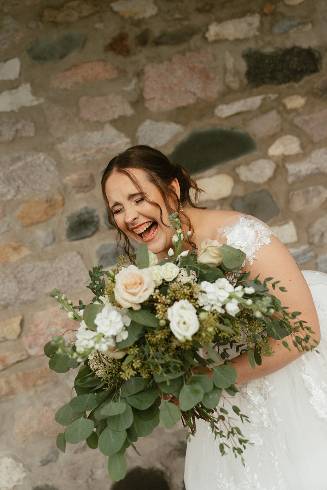 Candid portrait of the bride holding her bouquet