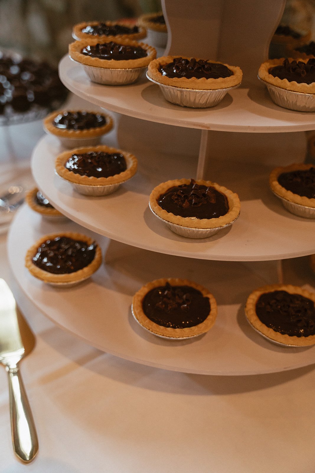 Individual mini pies arranged on a dessert table