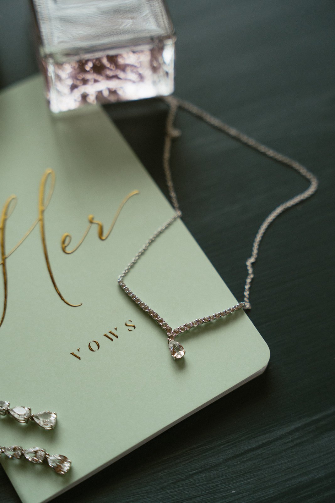 Flat lay of wedding stationery and matchbook with Mrs. detail