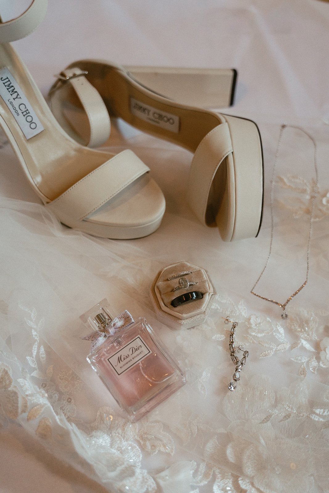 Flat lay of bridal shoes and jewelry